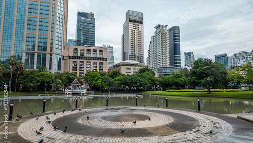 Photography Bangkok Benchasiri park lake and modern skyscrapers, harmony of urban skyline an