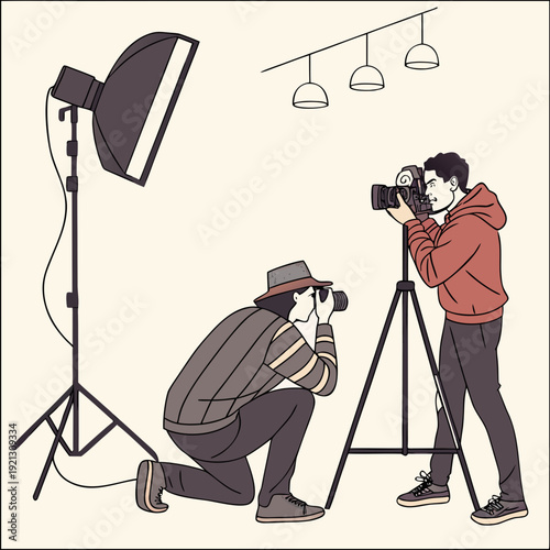Two photographers capturing images in a studio setting with professional lighting equipment 1.