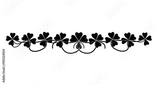 A decorative row of lucky black four-leaf clovers and shamrocks forming an elegant border, perfect for St. Patrick's Day designs, Irish themed events, or adding a touch of good fortune 