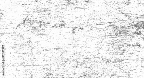 A close-up, high-angle shot of a distressed, textured, and scratched white surface.