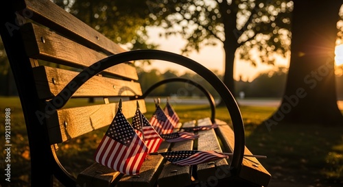 Memorial day tribute american flags on a park bench at sunset