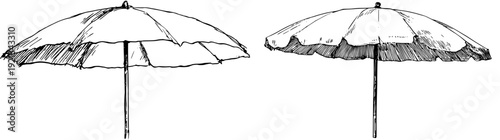 A whimsical wobbly yellow umbrella, a beacon of sunshine on the beach