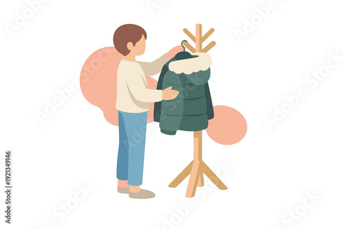 Person choosing a winter coat from a wooden stand.