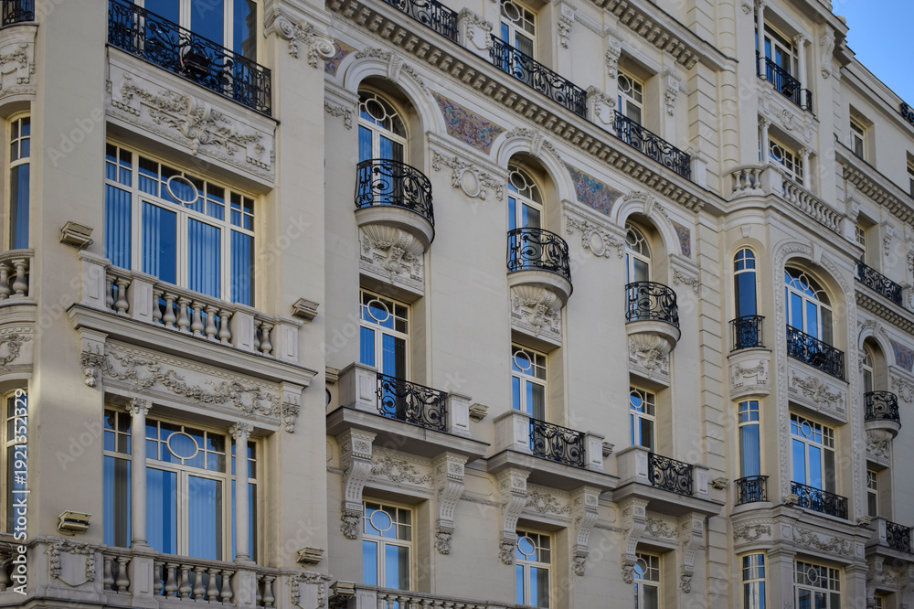 Fototapeta premium Elegant Historic Building Facade with Balconies and Ornaments in Madrid, Spain