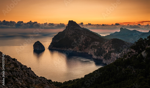 Fotografie Mallorca, Spain - Aerial view of a golden sunrise at the cliffs of Cap de Formen