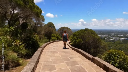 Woman walking on a scenic pathway.