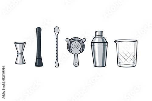 Collection of essential bar tools for cocktail preparation and mixing drinks