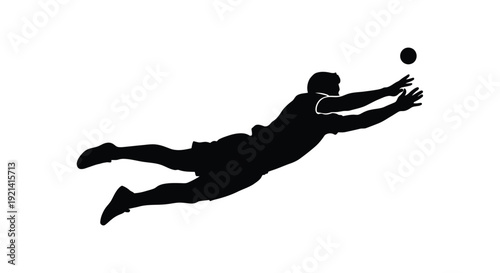 A goalkeeper dives to save a ball in dynamic action silhouette