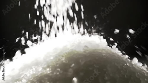Rice pouring with closeup, and dark background.