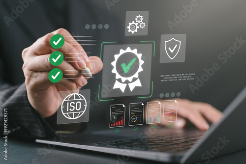 Photos Business professional using laptop for ISO certification and compliance, with digital checklist, quality assurance, document validation, and performance monitoring