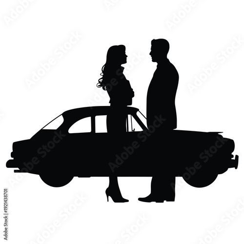 Silhouette of a couple standing near a classic vintage automobile
