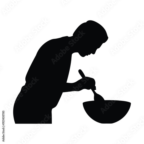 Silhouette of a person mixing ingredients in a bowl with a spoon
