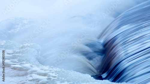 Flowing water at rapids of Vieremänkoski (Forssa, Finland) at cold February morning with –20 Celsius.