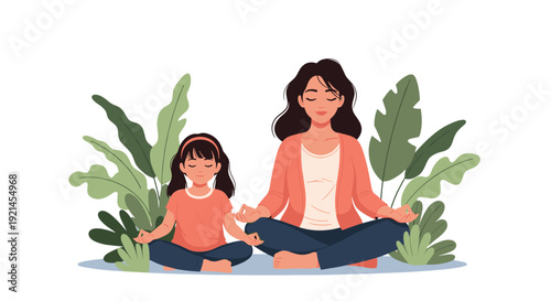 Peaceful mother and her young daughter sitting in a lotus position and meditating together surrounded by green tropical leaves.