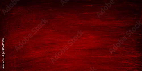 A dark red grunge texture featuring an aged vintage surface with a dirty paper pattern and weathered material design for a rustic wallpaper backdrop