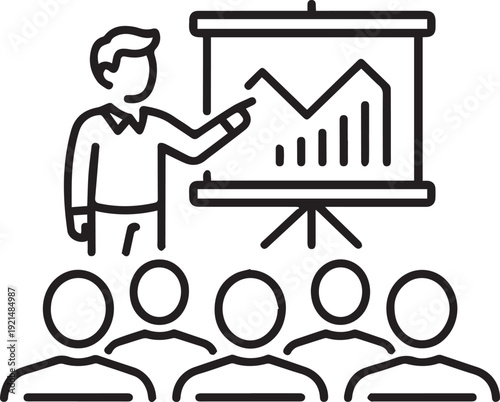 Instructor points to a fluctuating line graph on a presentation screen while addressing an audience of silhouetted figures.
