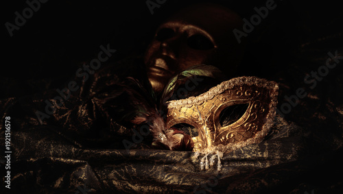 Fotografie Golden carnival masks on a dark background.