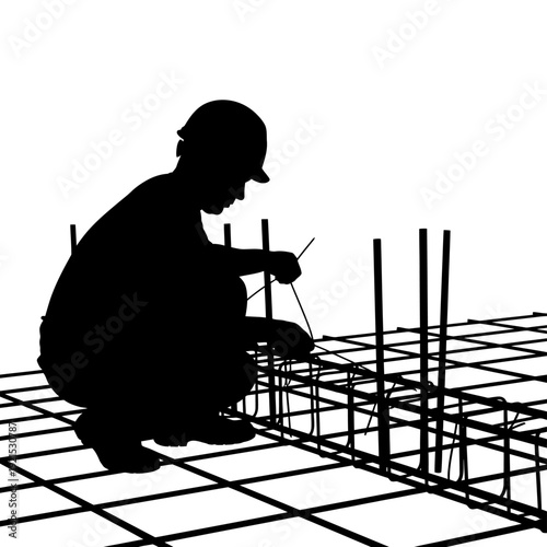 Silhouette of a Construction Worker Tying Rebar for Building Foundation.