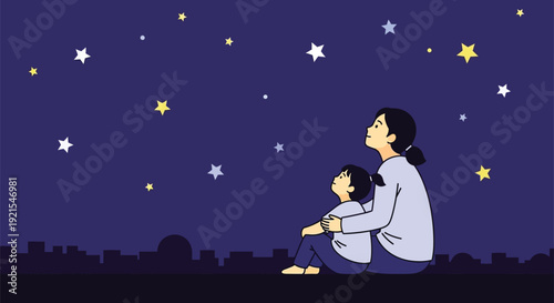 Mother and child sitting outdoors looking at stars in night sky