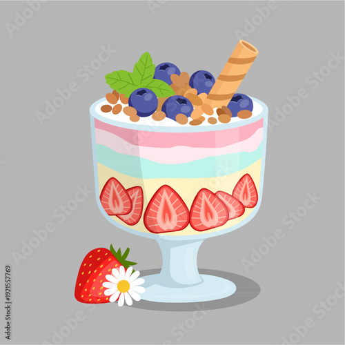 Layered strawberry yogurt parfait with granola topping, blueberries, and fresh mint leaf.