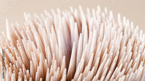 The photo shows a close-up of a wooden toothpick