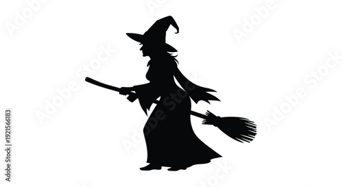 Silhouette of a witch on a broomstick flying through the air