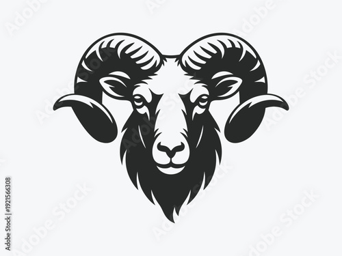 A stark minimalist image featuring a single dark silhouette of a bird in mid flight against a plain white background