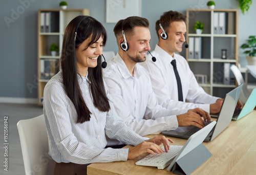 Canvastavla Call center team of professional operators wearing headsets working together in office, providing customer support and service