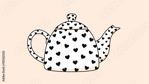 Classic ceramic teapot decorated with a whimsical black heart pattern is presented on a soft peach-colored background for a cozy look.