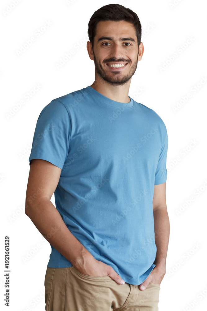 Obraz premium Smiling young man in blue t-shirt with hands in pockets looking at camera, casual portrait