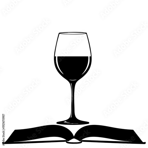Wine glass resting upon an open book