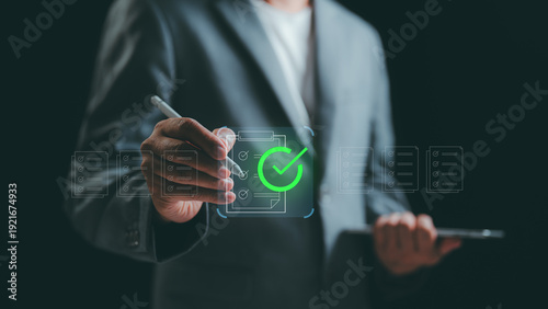 Fotografi A Businessman checks a digital document with document management, approval process, representing paperless workflow, modern business operation, business automation and financial ecosystem