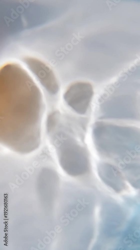 Shifting Liquid Light Focus on the mesmerizing interplay of light dancing through an unseen, clear liquid medium, creating complex, organic caustic patterns.