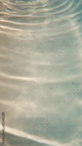 Abstract Liquid Light Focus on the mesmerizing, non-representational dance of light created by water refraction, emphasizing its fluid, organic movement and artistic qualities.