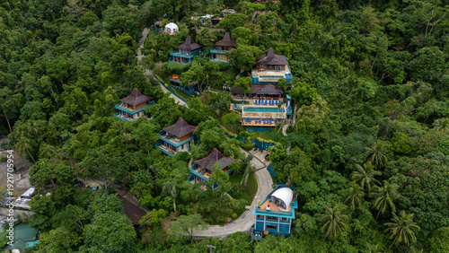 Drone aerial view of Karuna villas on the mountain near Corong Corong next to El Nido, The Philippines.