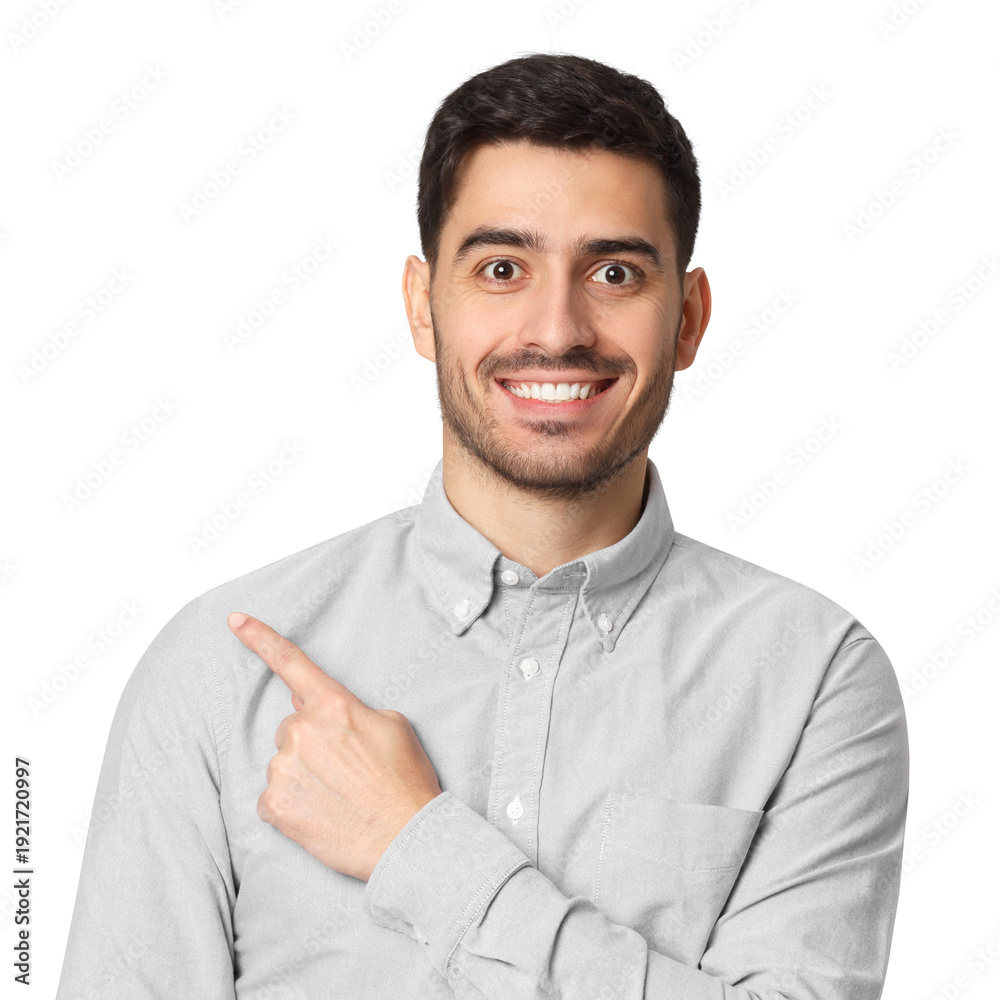 Fototapeta premium Young man in grey casual shirt smiling and pointing sideways with arm crossed, no glasses