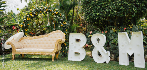 Tableau sur toile decorated chair next to a sign with initials