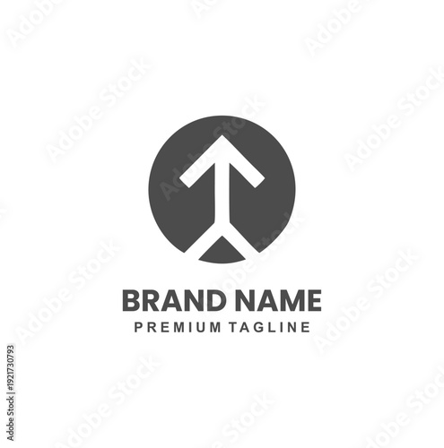 Minimalist arrow pointing upwards inside a dark grey circle.