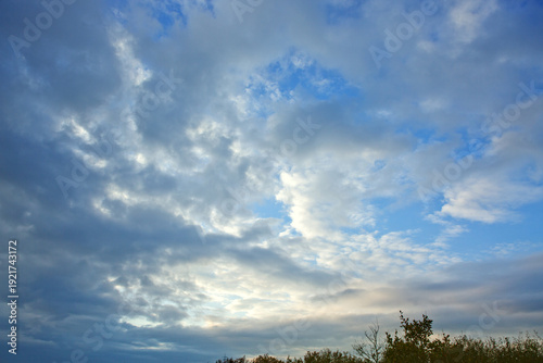 Evening sunshine background with clouds dramatic sky.