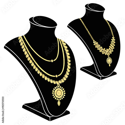 Gold necklaces on black jewelry display stands gold jewelry