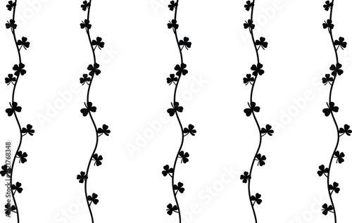 Beautiful aerial view of a lone traveler standing on a mountain peak at sunrise overlooking a misty valley with golden sunlight and blue sky