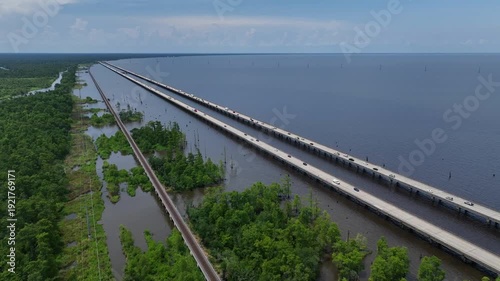 Wallpaper Mural Cars Traveling on raised highway over Louisiana Lake Ponchartrain beside natural wetland bayou at Good Hope, LA Torontodigital.ca