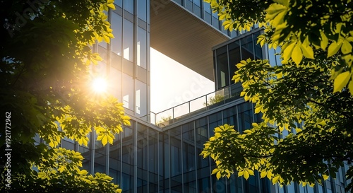 Modern office building with trees and sun shining through the windows on a bright day outside corporate architecture
