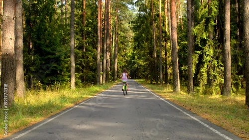 Wallpaper Mural Beautiful young girl is riding bicycle Torontodigital.ca