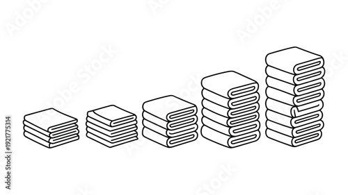 Stacked folded towels in increasing size order on keywords: white background textile fabric