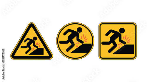 Warning signs depicting a person tripping over an obstacle with sparks keywords: danger hazard caution