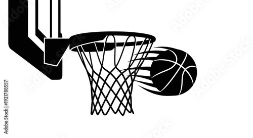 Ball entering a basketball hoop silhouetted.