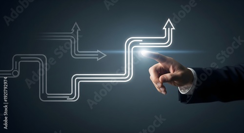 Hand of a businessman pointing at a glowing arrow among multiple branching paths, representing strategic decision-making, future direction, and growth.
