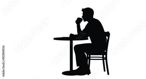 Silhouette of a man seated at a table possibly drinking