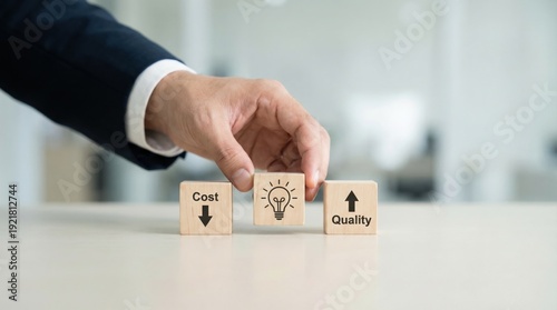Businessperson hand positioning wooden blocks with cost reduction, innovative idea, and quality improvement icons on office table for optimal business efficiency and value maximization